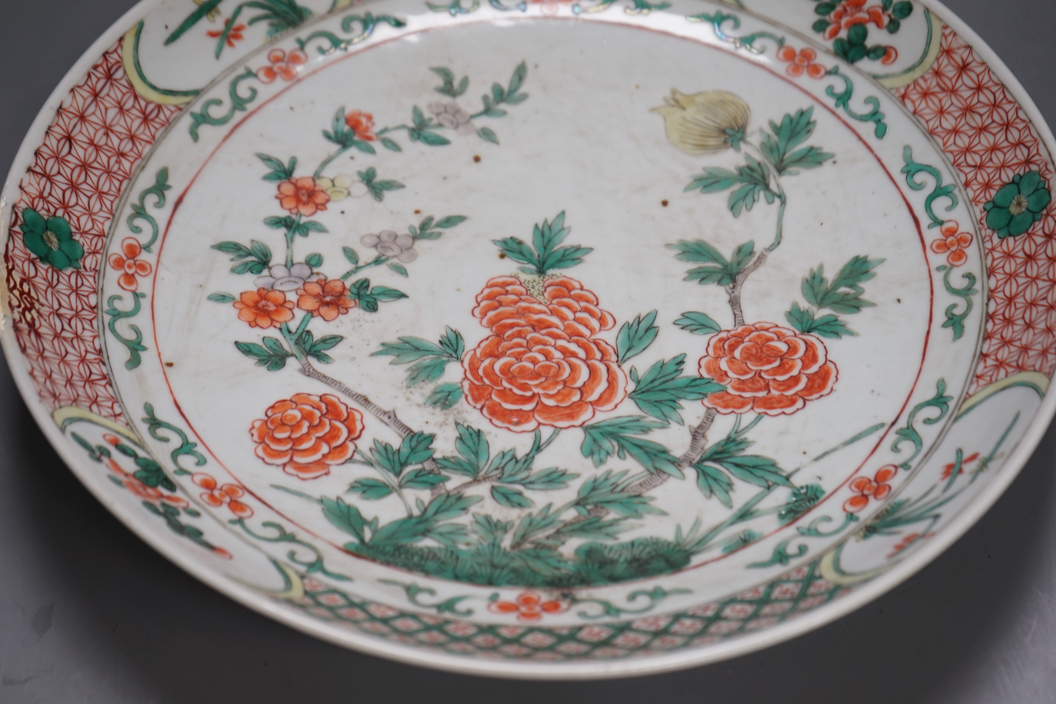 A large 19th century Chinese famille verte peony and dragon dish, 38.5cms diameter